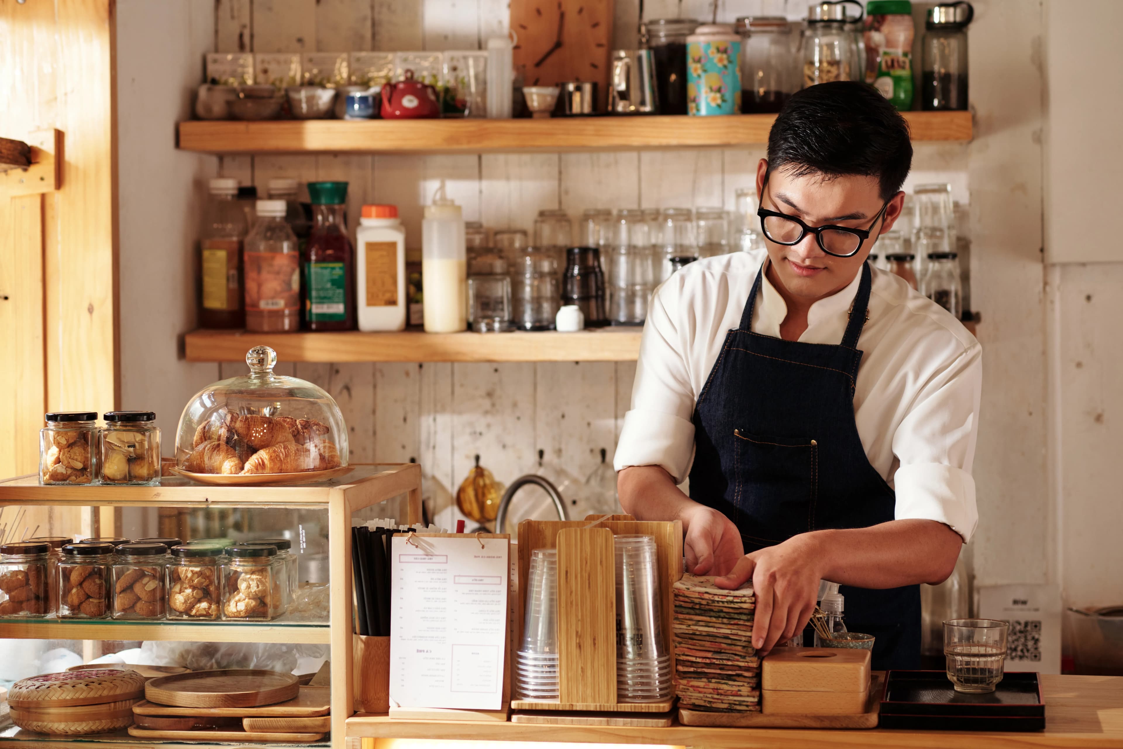 Small business owner working in a cafe